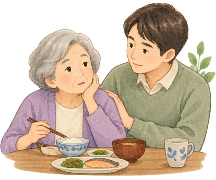 食事介助を受ける女性